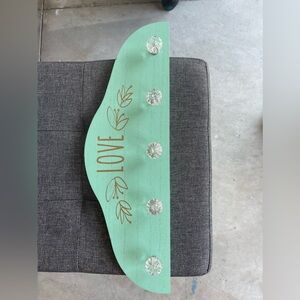 Decorative jewelry or purse hanging piece.